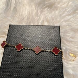 Elegant Gold and Red Clover Bracelet